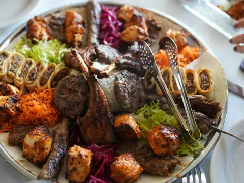 A large sharing platter of grilled meats and vegetables